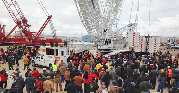 A crowd bidding on a crane
