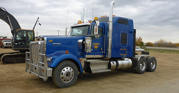 A 2014 Kenworth T800W wide nose truck tractor