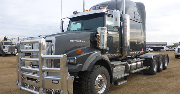 A 2014 Western Star 4900SB tri drive sleeper truck tractor sold in Edmonton, AB