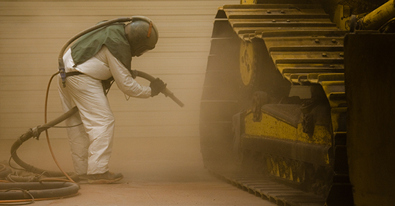 Painting heavy equipment before it’s sold