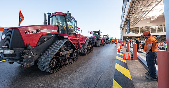 Belted ag tractors being sold at a Ritchie Bros. auction